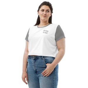 Plus-size model in white cropped tee with grey sleeves, neckline, and "IT'S COOL TO CARE" text at left pocket area